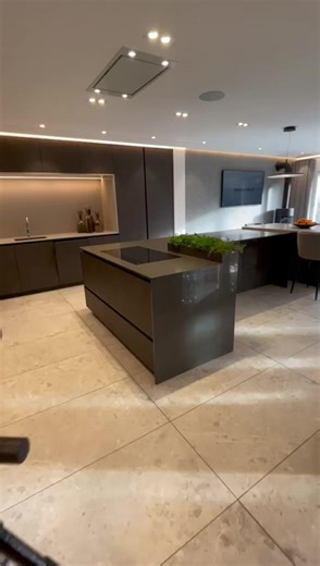 Take a look at this beautiful kitchen with a large, multipurpose island. Plenty of space to cook & socialize or watch tv #kitchen #interiordesign #homedecor #darkkitchen #kitchenisland