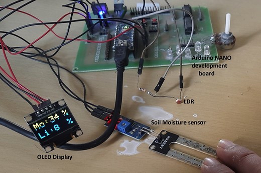 How to display LDR and soil-moisture sensor values using an OLED