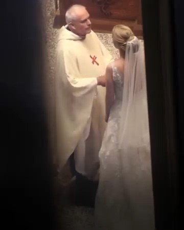 I've been a priest for over twenty years and thought I'd seen it all—until this wedding. It all began like any other Saturday ceremony. The groom was cheerful, guests were smiling, music played softly. Then the bride walked in—graceful, beautiful, but something was off. Her smile was forced, her eyes fixed on me, not her groom. Pleading. I asked for their vows. The groom handed his over. When she gave me hers, her hands trembled. I unfolded the paper and froze. Between the lines of her vows were