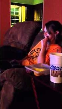 My wife laughing at the computer.