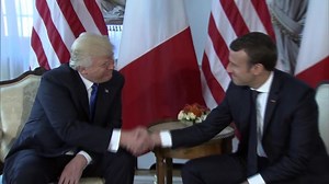 Watch Trump and Macron's extended handshake