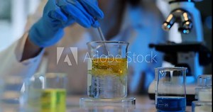 Chemical laboratory experiment. Measuring density of liquid oil and water