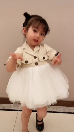 Stylish Dance Moves by a Young Girl in Tulle Skirt