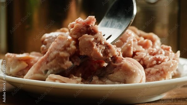 Sayra or cod fish close-up macro. Canned fish with oil. Canning delicious fish in golden and silver cans with pull rings. Canned tourist food and fish or wet pet food, pate