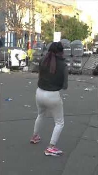 Protesters throw bricks at riot police