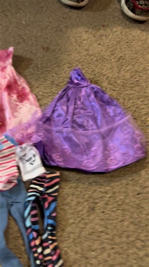 The fashion accessories your little girls dolls will ever need are included in this set. There is ball gowns there’s pants or shirts there’s bathing suits and there is a bunch of accessories. #Dolls #FashionDolls #Fashion #Dressup #GiftsForGirls.