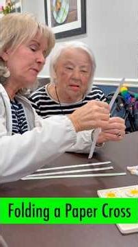 Folding a paper cross with my mom #palmsunday #memorycare #agedcare #easter #poppyflower #papercraft