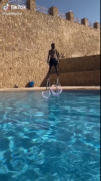 Dramatic Dive from the Board into Clear Blue Water