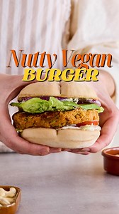129K views · 89 reactions | Craving burgers—but make it vegan (and high-protein)!  This chickpea and nut-packed patty delivers bold flavor, satisfying texture, and plenty of plant-based protein. Enhanced by aromatic oregano, thyme, and savory tamari, each bite pairs perfectly with creamy yogurt sauce and crisp veggies.  Protein-rich nuts ✨ Delicious creativity 塞 Fresh veggie boost  Hungry for more? Find the full recipe at our link in bio! | Nutfruit | Facebook