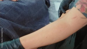 Master applying regenerative treatment cream after depilation in beautician office close up. Depilation. Epilation. Beauty concept