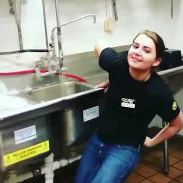 Girl gets ice put down her tucked in shirt