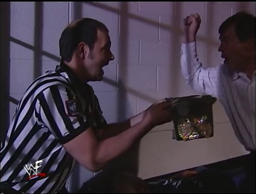 Gerald Brisco wins the Hardcore Title while Crash Holly sleeps