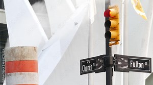 Steam vapor vented, New York City Church, Fulton street, orange vapour tube stack. Hot smoke pipe. Con Edison Steam Operations system, Manhattan downtown financial district architecture. Traffic light