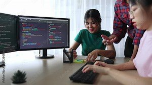 Back end software developer engineer for computer programming working together on debugging writing computing code, solving complex algorithms display on monitor in office. Burgeoning