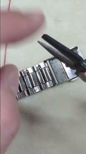 How to add and remove links on a folded metal type watch bracelet.