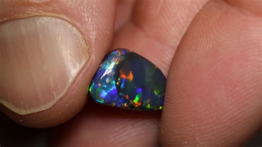 An opal within an opal — a unique and unusual find! These rare anomalies make every cut a little more thrilling when they emerge from the rough. 2.99ct black opal 13.2×8.7×4.4mm https://blackopaldirect.com/product/opal/black-opal/2-99-ct-black-opal-13-2x8-7x4-4mm/ | Black Opal Direct