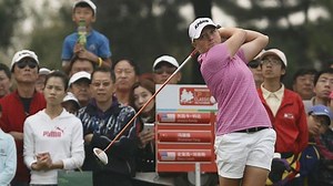 Chinese golfer stars at home
