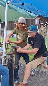 Otto has us on tenterhooks as he tenders a tenacious tendril under a tent on our Tenth! Thanks for the terrific tutelage, Mark! @thebritishblacksmith #tendrils #tenthanniversary #thebritishblacksmith #gourds #celebration #fun #thanks #forge #anvil #mandril #gourdlandia | Gourdlandia