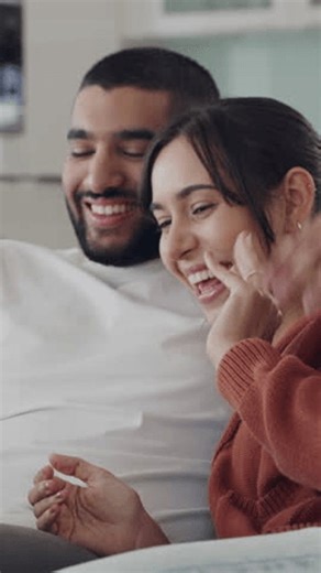 clip-4015205749-couple-video-call-tablet-on-sofa-wave