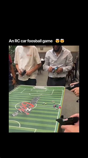 Congenai on Instagram: "An RC car foosball game is an interactive tabletop or floor-based game that combines traditional foosball and soccer mechanics with radio controlled vehicles. Players use remote controls to drive small cars and push a ball into the opponent's goal, acting as both player and car at the same time. Media : Victor Babani via ViralHog Follow @congenai for updates #RCCarFun #FoosballReinvented #TabletopGames #SoccerChallenge #RemoteControl #ViralGames #GamingFun"