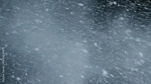 Heavy snow blizzard with wind motion, winter storm background texture.