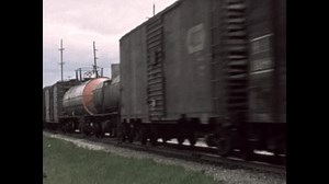 United States CIRCA 1960s: Train passing on tracks.
