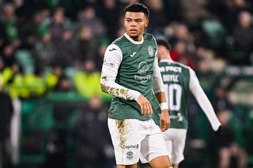 Hibs fans cheer the team on during their Scottish Premiership match against Dundee United