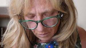 Close-up of a woman mending a garment, focused and skilled handwork. Her hands move with precision as she repairs the fabric Stock Video