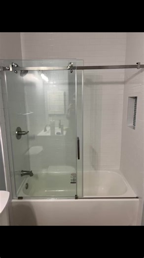 Shower renovation project. Removed bathtub insert. Installed new metal bathtub, new drain, shower valve/ head. Also built niche and installed subway tile to the ceiling. Installed new glass shower doors , vanity and exhaust fan. Amazing job. Give us a call for any household renovation 828 476-9216 or 828 550-2241 free estimates, licensed and insured. Re-New-It Renovations LLC