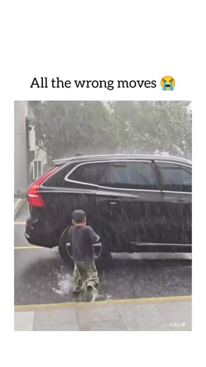 pubewitty on Instagram: "This might be the most counter-productive attempt to get into a car during a downpour we've ever seen!​What Went Down:Two kids rush to get into the backseat of the car during an absolute torrential rainstorm.​Kid #1 (Stripe shirt) runs to the far side (driver's side in this case) and opens the rear door, stepping inside.​Kid #2 (Green pants) runs to the near side... and promptly ducks under the car and tries to join his brother by crawling under the open door on the oppo