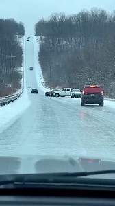 Icy Hill Leads to Dramatic Chain Reaction Charlevoix, Michigan — November 18, 2025 A quiet stretch of highway transformed into a frozen trap Tuesday afternoon as a sudden drop in temperature turned a steep incline into a sheet of solid ice. Several motorists found themselves completely helpless as their vehicles lost traction, sliding uncontrollably down the hill and into a growing pileup at the base of the grade. Captured on video, the chain-reaction event began when a black sedan spun sideways