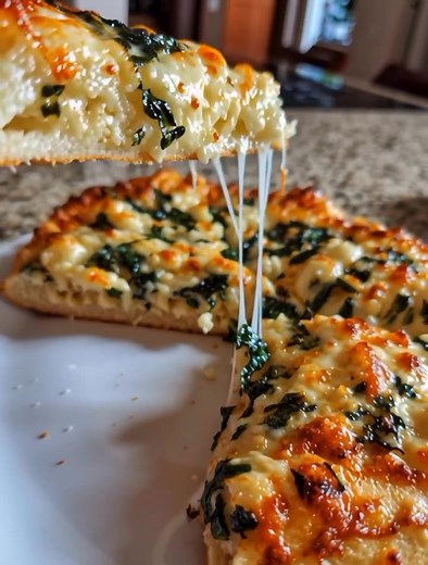 Garlic & Spinach White Pizza on Cottage Cheese Crust 🥬🧄🧀 – Savory, High-Protein & Low-Carb Crispy, cheesy, and loaded with flavor — this high-protein white pizza starts with a cottage cheese crust and is topped with garlicky spinach and melted cheese. It’s the perfect guilt-free way to enjoy pizza night! 🍕 Ingredients For the Cottage Cheese Crust: 1 cup cottage cheese 2 large eggs ½ cup almond flour (or oat flour for a lighter texture) 1 tsp baking powder Pinch of salt For the Topping: 1 cup