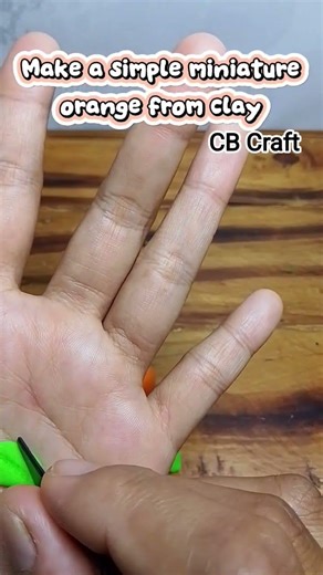 Make a simple miniature orange from clay