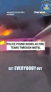WATCH: Police POUND on doors as fire tears through motel