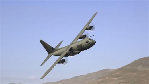 An RAF C-130 threads a narrow Welsh valley at low level