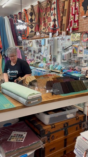 Here is the look on Debs' face when I ask her to fold bundles...She loves it!!! She is re-bundling the Body of "Come on-a my House" quilt top, 30 - 18" X 22" fat qts. Cotton boarders, binding & backing sold separately 30fqcomeonhouse. I will have them on the website later today. These bundles seem to go quite fast as they are just beautiful fabrics. | Ma's Got'a Notion