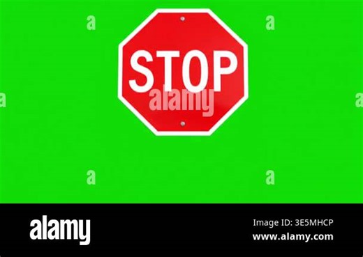 Red octagonal stop sign animation appears and stays then fades on green screen Stock Video Footage - Alamy