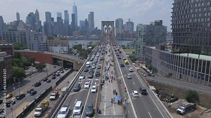 flying over pedestrian, bike and car lanes towards Brooklyn Bridge