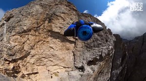 Wingsuit Pilot Flies Through Cloud at 4000 Meters Over Dolomites