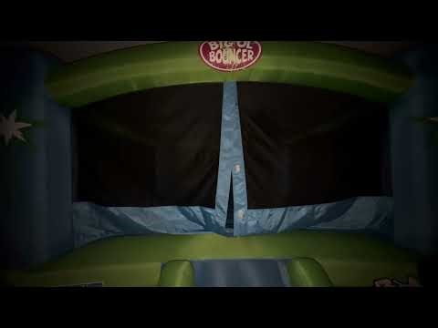 Jumping in the bounce house.