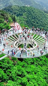 35K views · 868 reactions | This huge circular sightseeing platform named City of Sky, hangs in the front of a cliff offering a breathtaking panoramic view of the fairy island scenic area. Visitors need to walk a 74.6 meters (245ft) long walkway to admire the splendid view. Located in the city of Huangshi, central China's Hubei Province, this popular tourist spot is brimming with fresh air, green isles, flowing clouds and spectacular mountains. #Summer #BRICS | China Plus Culture | Facebook