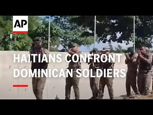 Haitians confront Dominican soldier at the border