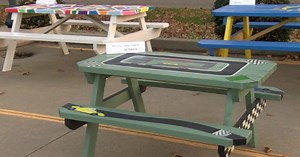 Community members in Dubois County pitch in to paint picnic tables