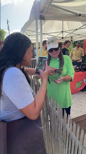 Snap a photo with a baby gator, a snake, or both at Everglades Holiday Park