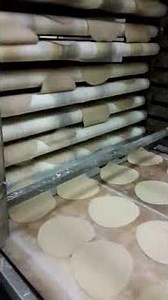 Arabic bread (kuboos) making. Automatic machine