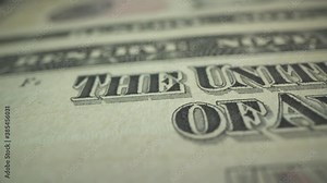 The united states of america sign on american bank note in macro shot. Watermark. 100 dollar bill. Slow panorama. Strong currency. Power.