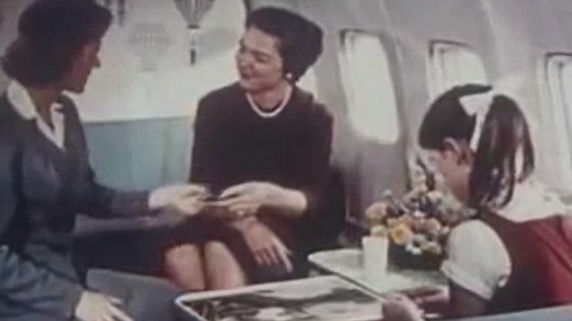 Passengers excitedly board Pan American airlines plane circa 1970