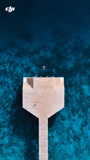Sun, sea, and a single leap. DJI Air 2S turns every jump into a cinematic moment. ✨ 🎬: IG/travelifejournal #DJIAir2S #DronePerspective #CinematicDrone #OceanJump | DJI