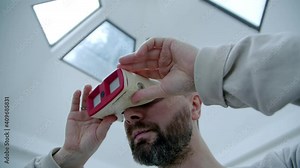 stereo slides are placed in a device for retro 3d viewing. retro virtual reality.