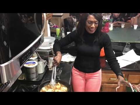 Auntie Fee Helps fry chicken